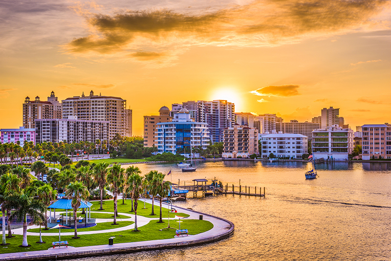 A stunning view of luxury condos in Downtown Sarasota at sunset